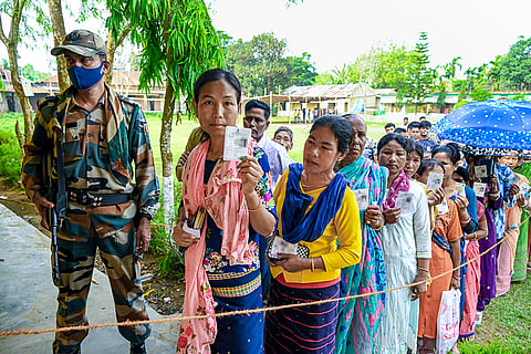Agartala: Voters show their ID cards as they wait in a queue to cast their votes during Tripura Tribal Areas Autonomous District Council (TTAADC) elections, outside a polling station, in Agartala, Tripura.