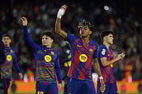 Barcelona 4-1 Espanyol, La Liga: Lamine Yamal Helps Blaugrana Move Nine Points Clear At Top | Photo: AP/Joan Monfort : Barcelona's Lamine Yamal, centre, and Barcelona's Xavi Espart, left, celebrate after the Spanish La Liga soccer match between Barcelona and Espanyol in Barcelona, Spain.