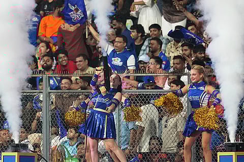Cheerleaders cheer for their team during the Indian Premier League cricket match between Mumbai Indians and Royal Challengers Bengaluru, in Mumbai, India.