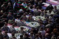 (AP Photo/Mohammed Zaatari)
Source: AP : Colleagues mourn over the coffins during the funeral of 13 state security officers killed the previous day in an Israeli strike in the Lebanese coastal city of Sidon, Saturday, April 11, 2026.