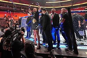 | Photo: AP/Rebecca Blackwell : Carlos Ulberg, center left, of New Zealand, celebrates after defeating Jiri Prochazka, of Czechia, by TKO to win their light heavyweight title bout at a UFC 327 mixed martial arts event in Miami.