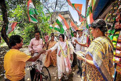 Congress candidate for Howrah Dakshin constituency, Deepsikha Bhowmick, centre, being greeted by people during an election campaign ahead of the West Bengal Assembly Election, in Howrah.
