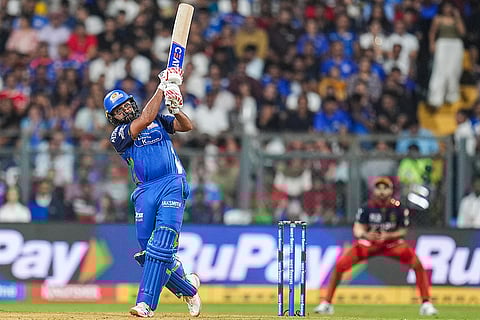 Mumbai Indians' Rohit Sharma plays a shot during an Indian Premier League (IPL) 2026 T20 cricket match between Mumbai Indians and Royal Challengers Bengaluru, in Mumbai, Maharashtra.