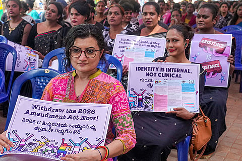 People from the LGBTQ+ community hold placards during a protest against the Transgender Persons (Protection of Rights) Amendment Act, 2026, at Freedom Park in Bengaluru.