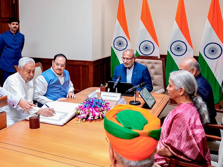 In this image posted on April 10, 2026, Vice President and Rajya Sabha Chairman CP Radhakrishnan administers oath to Bihar Chief Minister Nitish Kumar as a member of the House during a ceremony at the former's chamber at the Parliament House complex, in New Delhi. Union Ministers JP Nadda and Nirmala Sitharaman are also seen. - Source: PTI