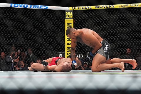 Carlos Ulberg, of New Zealand, strikes Jiri Prochazka, of Czechia, on his way to a TKO win in their light heavyweight title bout at a UFC 327 mixed martial arts event, Saturday, April 11, 2026, in Miami. 