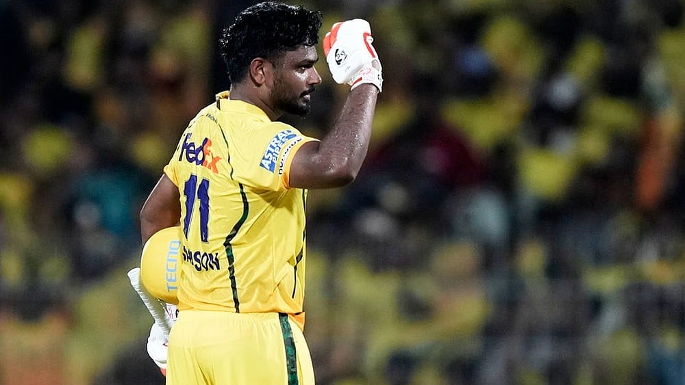 Chennai Super Kings' Sanju Samson celebrates his century during the Indian Premier League cricket match between Chennai Super Kings and Delhi Capitals in Chennai. - | Photo: AP/Mahesh Kumar A.