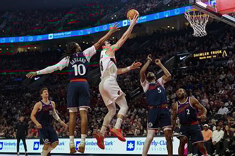 Portland Trail Blazers forward Deni Avdija (8) goes to the basket during the first half of an NBA basketball game against the Los Angeles Clippers in Portland, Ore.