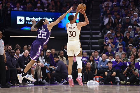 Golden State Warriors guard Stephen Curry (30) attempts a three point basket during the first half of an NBA basketball game against the Sacramento Kings in Sacramento, Calif.