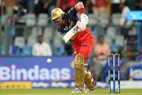 Royal Challengers Bengaluru's Phil Salt plays a shot during the Indian Premier League cricket match between Mumbai Indians and Royal Challengers Bengaluru, in Mumbai , India, Sunday, April 12, 2026. ()