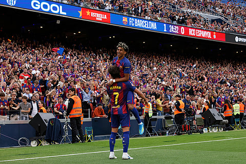 Barcelona's Ferran Torres, left, celebrates after scoring his side's second goal with Lamine Yamal during the Spanish La Liga soccer match between Barcelona and Espanyol in Barcelona, Spain.