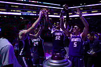 | Photo: AP/Scott Marshall : Sacramento Kings center Maxime Raynaud (42), Daeqwon Plowden (29), Dylan Cardwell (32) and Nique Clifford (5) light the beam after the Kings victory over the Golden State Warriors in an NBA basketball game  in Sacramento, Calif.