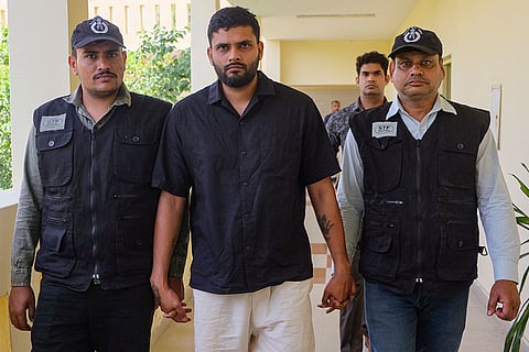 Special Task Force (STF) members escort arrested gangster Sahil Chauhan after his deportation from Thailand, in Gurugram, Haryana. Chauhan, wanted in multiple cases in different states and facing an Interpol Red Notice, was located in Bangkok by the Central Bureau of Investigation (CBI) using Interpol channels and was brought back to the Indira Gandhi International (IGI) Airport on Saturday morning.