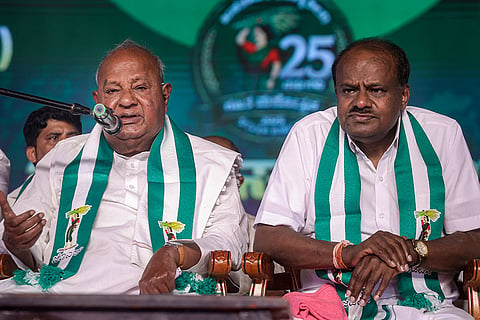 JD(S) chief and former prime minister H D Devegowda, left, with Union Minister and the party's Karnataka President HD Kumaraswamy during 'Janata Samavesha', in Bengaluru, Karnataka.