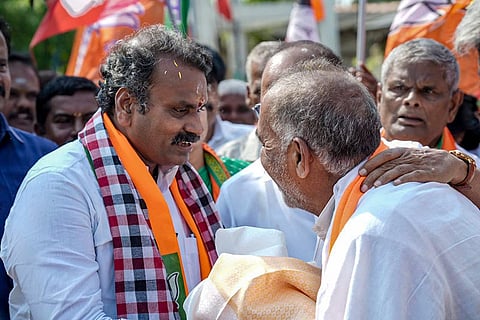 In this image posted on April 12, 2026, MoS L Murugan being greeted by people during an election campaign for Avanashi constituency ahead of Tamil Nadu Assembly Election, in Tiruppur district.