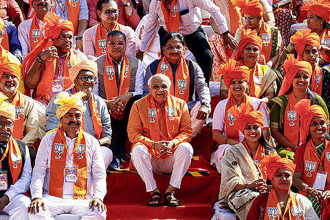 Gujarat Chief Minister Bhupendra Patel poses for photographs with BJP candidates for the upcoming Ahmedabad Municipal Corporation elections, near the statue of Pandit Deendayal Upadhyaya, in Ahmedabad, Gujarat.