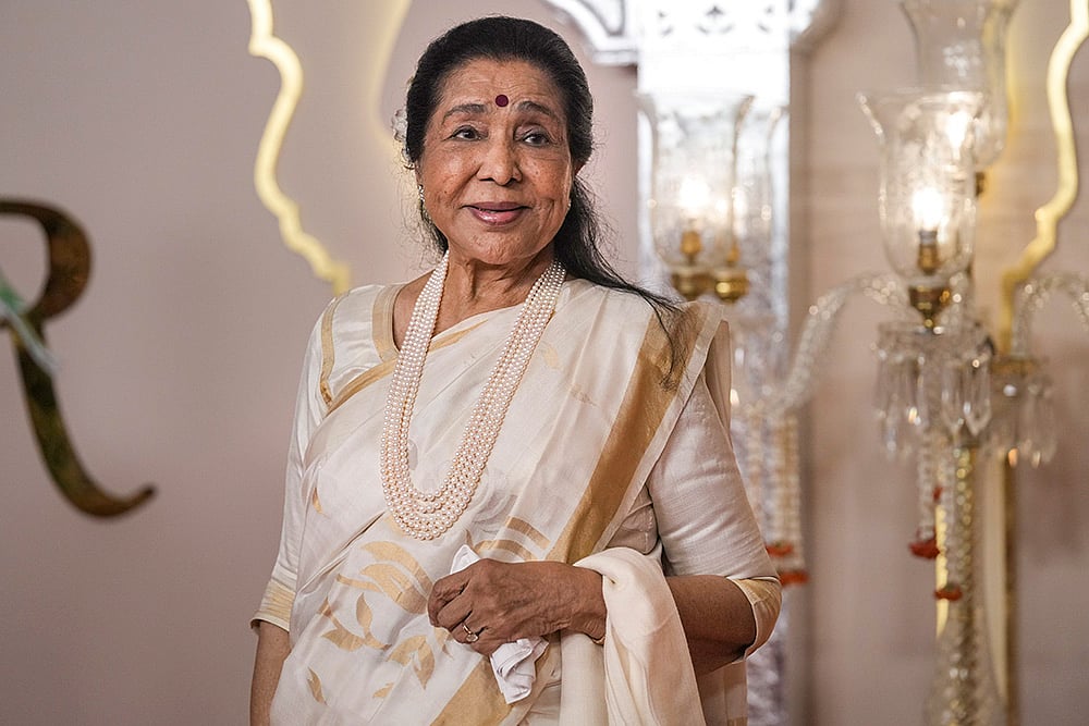 Singer Asha Bhosle is seen here during an event at Jio World Convention Centre in Mumbai, in this file photo dated Friday, July 12, 2024. She passes away at 92 in Mumbai. - | Photo: PTI/Kunal Patil