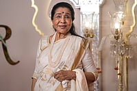 Indian Music Loses An Irreplaceable Voice: Asha Bhosle's Life In Pictures | Photo: PTI/Kunal Patil : Singer Asha Bhosle is seen here during an event at Jio World Convention Centre in Mumbai, in this file photo dated Friday, July 12, 2024. She passes away at 92 in Mumbai.