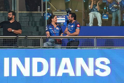 Bollywood actor couple Saif Ali Khan, right and Kareena Kapoor Khan talk as they attend to watch the Indian Premier League cricket match between Mumbai Indians and Royal Challengers Bengaluru, in Guwahati, India.