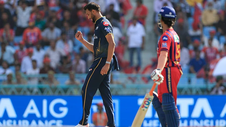 Prasidh Krishna celebrates Ayush Badoni's wicket during LSG vs GT IPL 2026 match at Ekana. - IPL/X