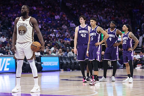 Golden State Warriors forward Draymond Green (23) prepares to take a free throw during the second half of an NBA basketball game against the Sacramento Kings in Sacramento, Calif.