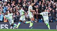 Chelsea 0-3 Man City, English Premier League: Second-Half Surge Keeps Title Race Alive For Cityzens | Photo: AP/Ian Walton : Manchester City's Marc Guehi, left, and Jeremy Doku celebrate after scoring during the Premier League soccer match between Chelsea and Manchester City in London, Sunday, April 12, 2026.