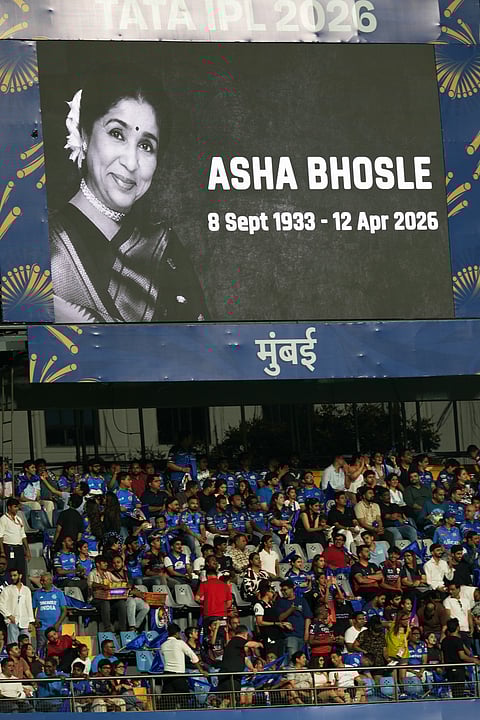 A tribute to legendary Indian singer Asha Bhosle reflects on the giant screen during the Indian Premier League cricket match between Mumbai Indians and Royal Challengers Bengaluru.