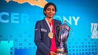 | Photo: FIDE/Michal Walusza via PTI  : In this image taken on Sept. 15, 2025, India's GM Vaishali Rameshbabu poses with her trophy after winning the FIDE Women’s Grand Swiss 2025, in Samarkand, Uzbekistan. Vaishali made it to the women’s Candidates tournament after a hard-fought draw against former world champion Zhongyi Tan of China. 