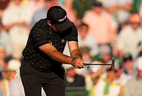 Patrick Reed reacts after missing a putt on the 18th hole during the third round of the Masters golf tournament at the Augusta National Golf Club, in Augusta, Georgia.