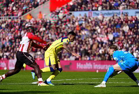 Sunderland's Brian Brobbey, left, push Tottenham Hotspur's Cristian Romero into Tottenham Hotspur goalkeeper Antonin Kinsky during the Premier League soccer match between Sunderland and Tottenham Hotspur, in Sunderland, England.