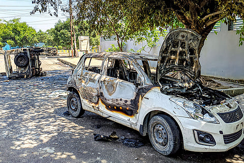Wreckage of vehicles is seen after they were burnt during a protest by factory workers demanding a hike in wages, in Noida, Gautam Buddh Nagar district, Uttar Pradesh. The protest carried incidents of arson, vandalism and stone-pelting reported from Phase-2 and Sector 60 areas, police said. 