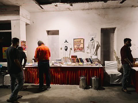 Books, postcards, badges and t-shirts for sale during the event