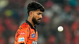 AP/Mahesh Kumar A. : Praful Hinge tosses the ball during the Indian Premier League match between Sunrisers Hyderabad and Rajasthan Royals in Hyderabad.