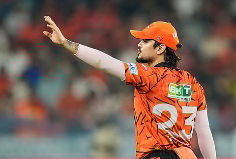 Sunrisers Hyderabad's captain Ishan Kishan arranges field during the Indian Premier League cricket match between Sunrisers Hyderabad and Rajasthan Royals in Hyderabad.