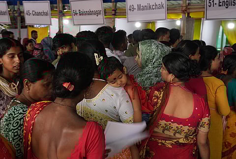 People wait to submit petitions before the Special Tribunal after their names were deleted from the Special Intensive Revision final voter list ahead of the West Bengal Assembly elections in Malda
