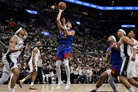 Denver Nuggets guard Julian Strawther (3) shoots during the second half of an NBA basketball game against the San Antonio Spurs in San Antonio.