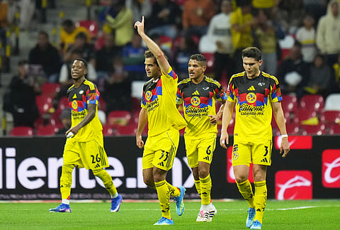 America's Patricio Salas (33) celebrates scoring his side's opening goal against Cruz Azul during a Mexican soccer league match in Mexico City.