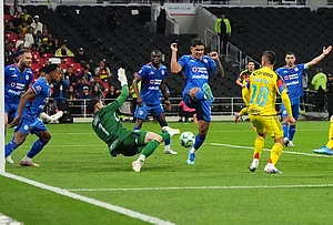 | Photo: AP/Eduardo Verdugo : Cruz Azul's goalkeeper Andres Gudino (1) makes a save during a Mexican soccer league match against America in Mexico City.