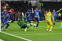 | Photo: AP/Eduardo Verdugo : Cruz Azul's goalkeeper Andres Gudino (1) makes a save during a Mexican soccer league match against America in Mexico City.