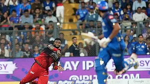 | Photo: AP/Rafiq Maqbool : Royal Challengers Bengaluru's Romario Shepherd throws a ball during the Indian Premier League cricket match between Mumbai Indians and Royal Challengers Bengaluru, in Mumbai , India.