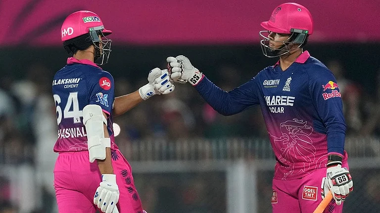 Rajasthan Royals' Vaibhav Sooryavanshi, right and Rajasthan Royals' Yashasvi Jaiswal toss during the Indian Premier League cricket match between Royal Challengers Bengaluru and Rajasthan Royals in Guwahati, India. - | Photo: AP/Anupam Nath
