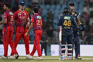 | Photo: AP/STR : Gujarat Titans' Rahul Tewatia and Washington Sundar celebrate after winning the Indian Premier League cricket match between Gujarat Titans and Lucknow Super Giants in Lucknow, India.