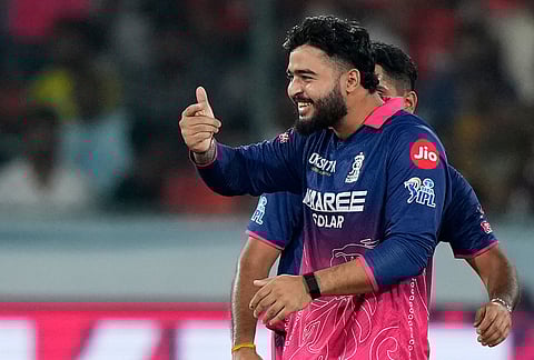 Rajasthan Royals' captain Riyan Parag celebrates the wicket of Sunrisers Hyderabad's Travis Head during the Indian Premier League cricket match between Sunrisers Hyderabad and Rajasthan Royals in Hyderabad.