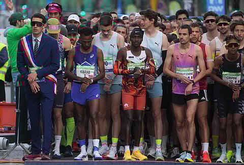 Competitors prepare to run the men's race of the Paris marathon, in Paris.