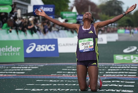 Ethiopia's Shure Demise crosses the finish line to win the women's race of the Paris marathon, in Paris.