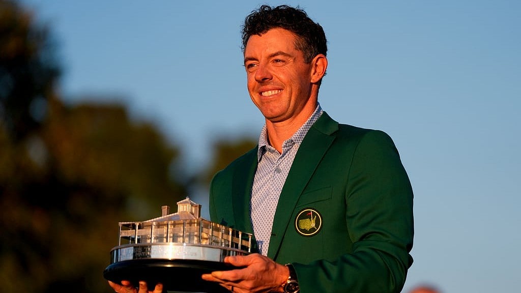 Rory McIlroy, of Northern Ireland, holds the trophy after winning the Masters golf tournament at the Augusta National Golf Club. - AP