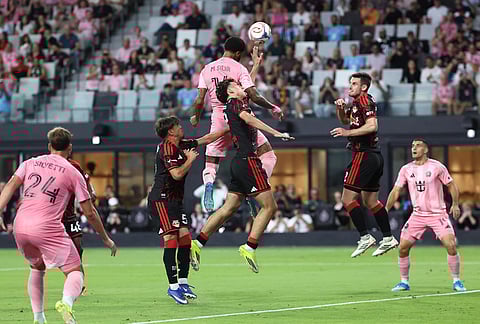 Inter Miami defender Micael, center top, attempts a header in the first half of an MLS soccer match  against the New York Red Bulls, in Miami.