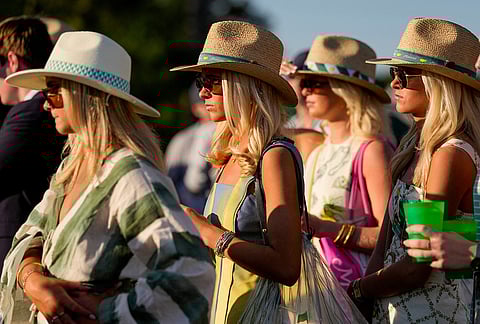 Patrons watch on the 17th hole during the third round of the Masters golf tournament at the Augusta National Golf Club, in Augusta, Georgia. 