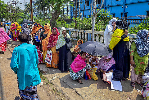 People gather to appeal before a tribunal over issues related to the Special Intensive Revision (SIR) of electoral rolls, ahead of the West Bengal Assembly elections, in Murshidabad, West Bengal.