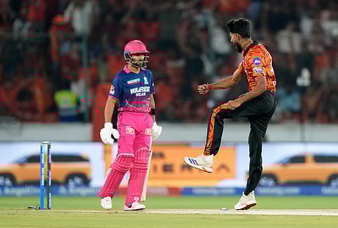 Rajasthan Royals' Praful Hinge celebrates the wicket of Rajasthan Royals' Dhruv Jurel, left, during the Indian Premier League cricket match between Sunrisers Hyderabad and Rajasthan Royals in Hyderabad.